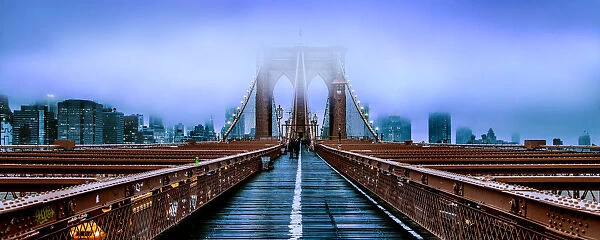 Brooklyn Bridge at dusk under a cloud of fog
