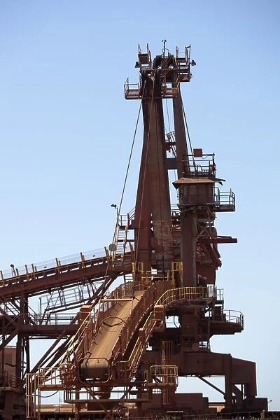 A bucket wheel reclaimer in an iron ore mine