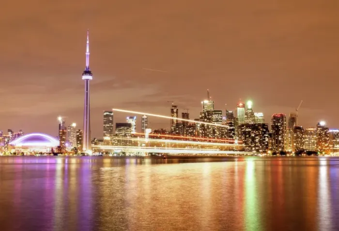 Framed Print : Canada, Ontario, Toronto, Illuminated waterfront skyline and CN Tower reflecting in Lake Ontario with passing ferry light trails Framed Print : Canada, Ontario, Toronto, Illuminated waterfront skyline and CN Tower reflecting in Lake Ontario with passing ferry light trails