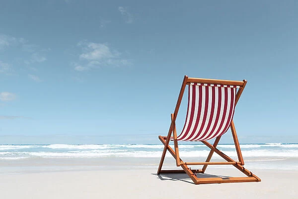 Canvas deck chair on a beach. Australia