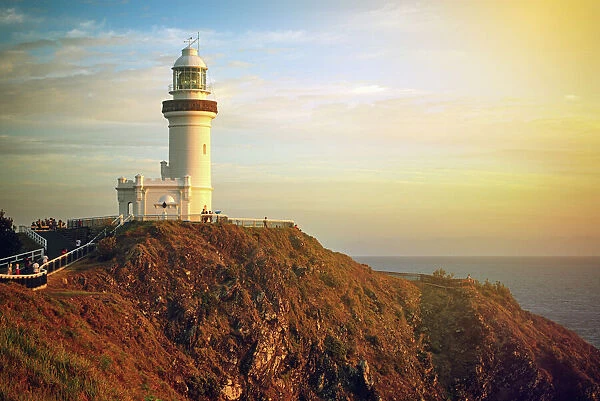 Cape Byron Lighthouse on a cliff at sunrise, Byron Bay, Australia, Oceania