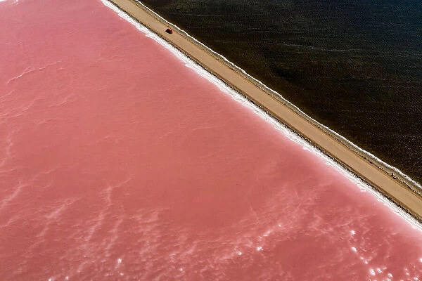 Car driving past Lake MacDonnell (Pink Lake) - Aerial