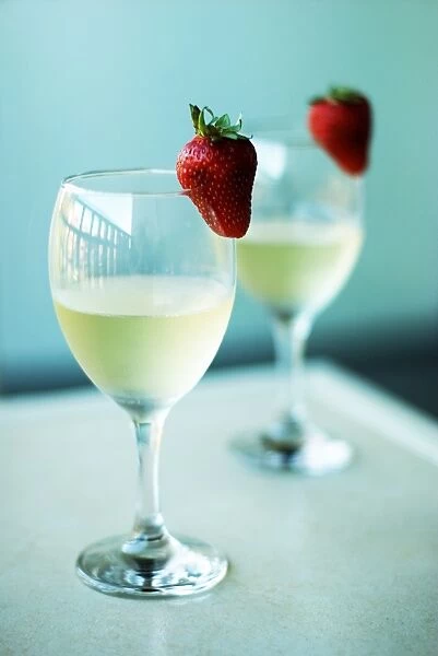 Cheers. Wine glasses with strawberries