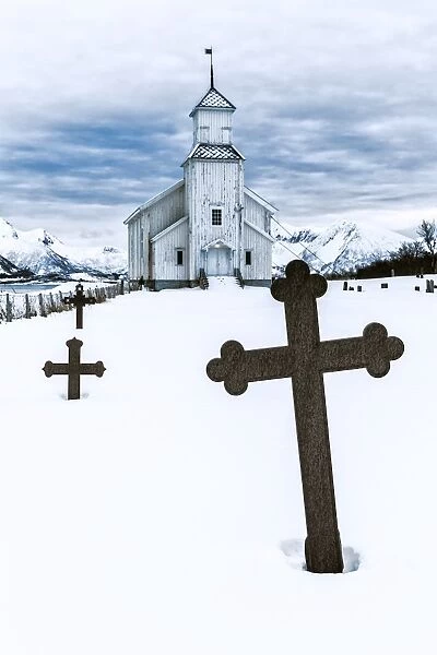 Church in GimsA┼¥y with graveyard during winter time