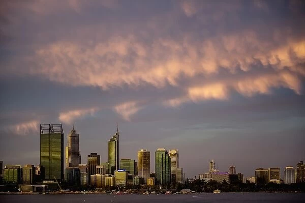 City skyline on water at sunset, Perth, Australia