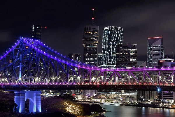 Cityscape of Brisbane City and the Story Bridge taken at night from across the Brisbane