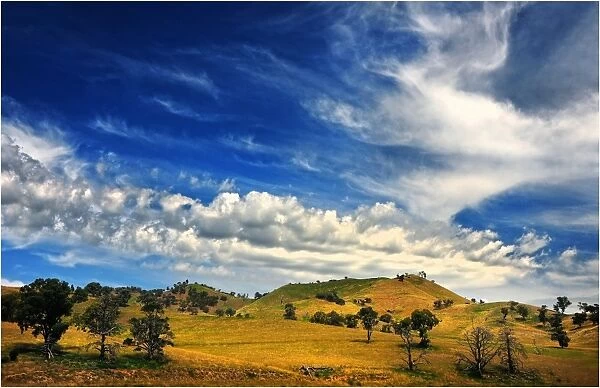 A cloudscape over rolling countryside near Bonnie Doon, Central Victoria