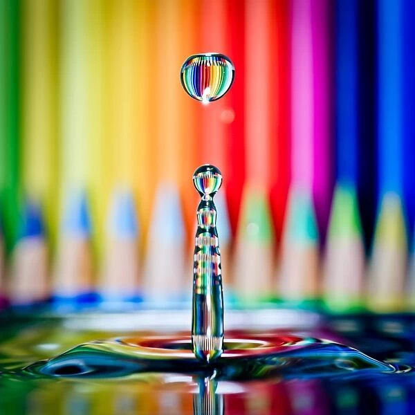 Colored pencils refracted in waterdrop