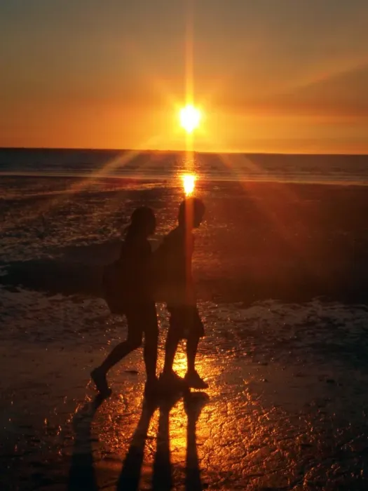 Framed Print : Couple on beach at sunset Framed Print : Couple on beach at sunset
