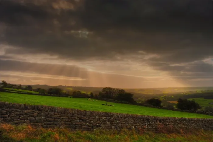Framed Print : Crepuscular Rays over Farmland