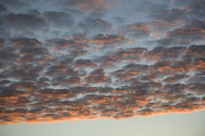 Framed Print : Many cumulus clouds covering the sky at dusk Framed Print : Many cumulus clouds covering the sky at dusk