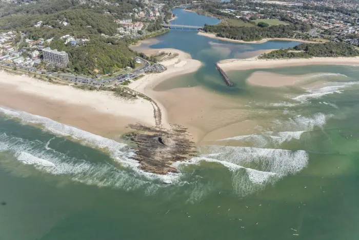 Framed Print : The Currumbin Creek pen into the ocean Aerial