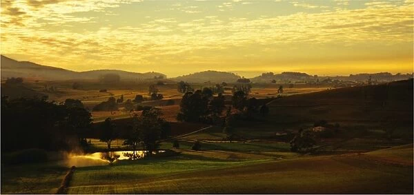 Dawn lights up the countryside near Sheffield, central Tasmania
