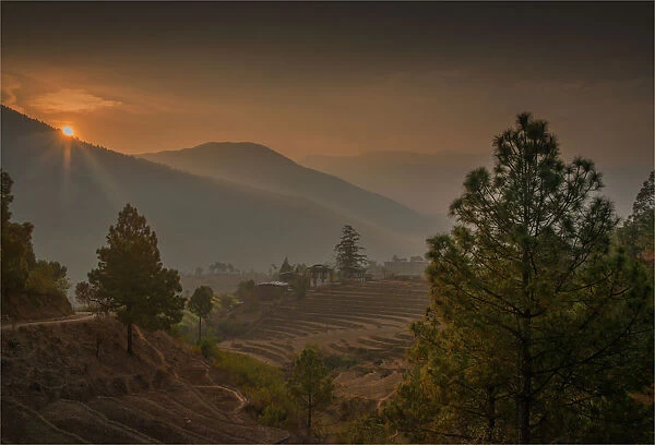 A dawn sky lights up the Punakha valley in Bhutan