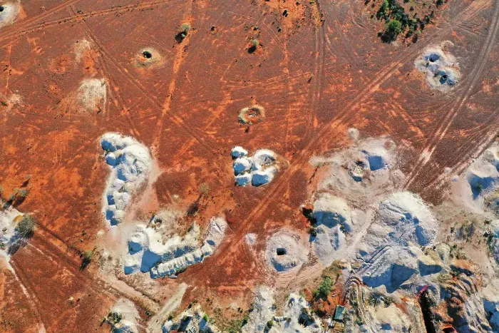 Framed Print : Desert landscape with mineshaft holes, white dirt mine tailings on red earth, White Cliffs, Australia