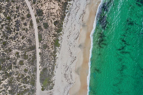 Dirt road to a nice sandy beach - Aerial view