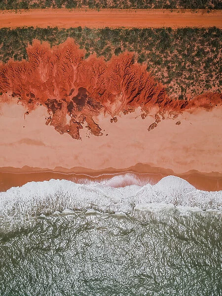 A dirt road, unusual geology, a beach and the ocean as seen from above, Western Australia