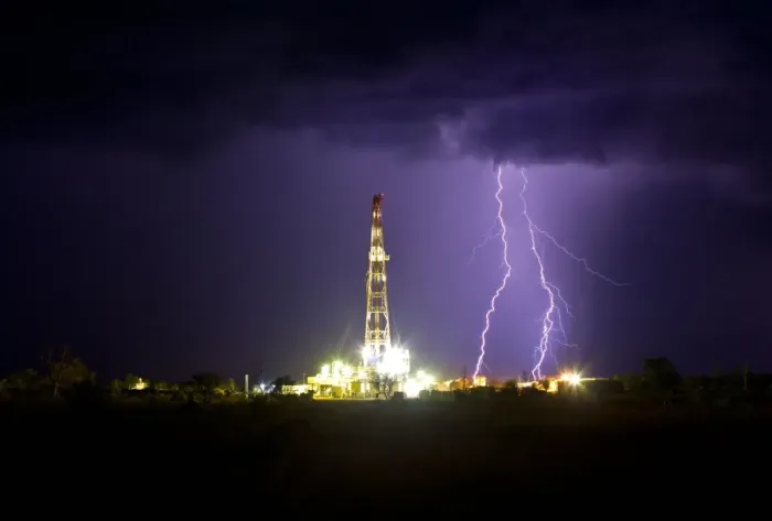 Framed Print : Drilling under thunderstorm
