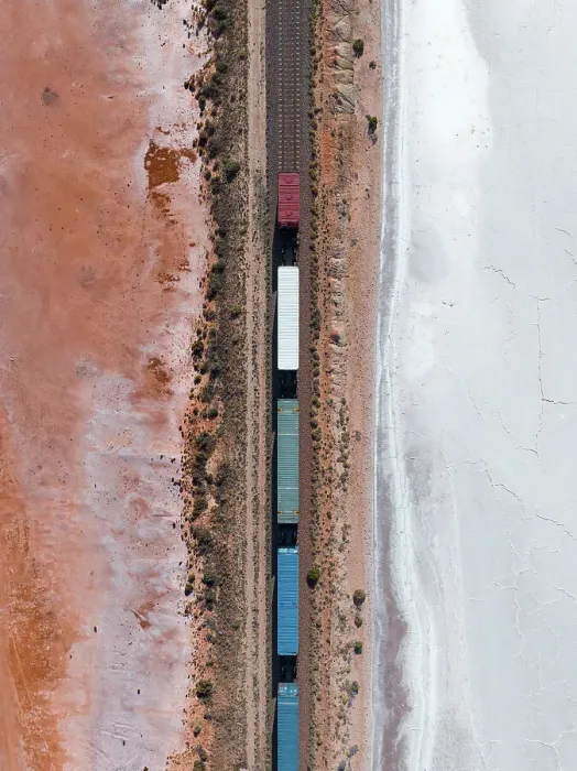 Framed Print : Drone image looking down on a freight train crossing a salt lake, South Australia, Australia