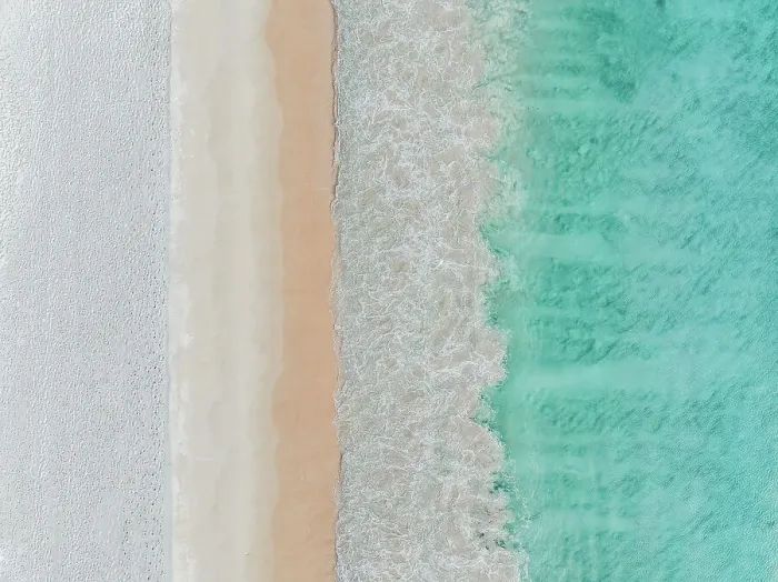 Framed Print : Drone image looking down on Ocean waves rolling onto Cottesloe Beach, Perth, Western Australia, Australia
