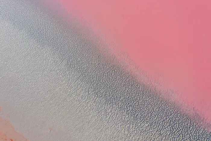 Framed Print : Drone view point of the pink shades of color, patterns and textures over Pink Lake waters with dark salty sandy soil Framed Print : Drone view point of the pink shades of color, patterns and textures over Pink Lake waters with dark salty sandy soil