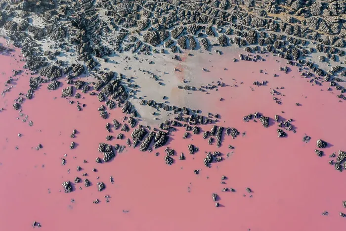 Framed Print : Drone view point of the pink shades of color, patterns and textures over Pink Lake waters with dark salty sandy soil Framed Print : Drone view point of the pink shades of color, patterns and textures over Pink Lake waters with dark salty sandy soil