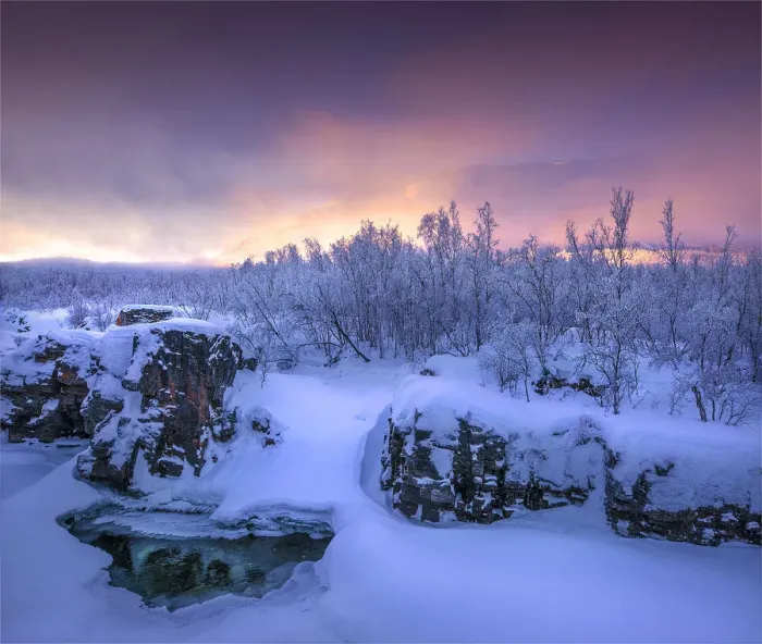 Framed Print : Dusk comes over a winter scene at Abisko National park in Lapland, Sweden