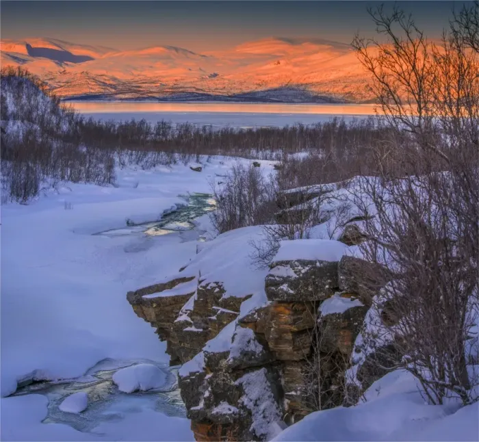 Framed Print : Dusk comes over a winter scene at Abisko National park in Lapland, Sweden
