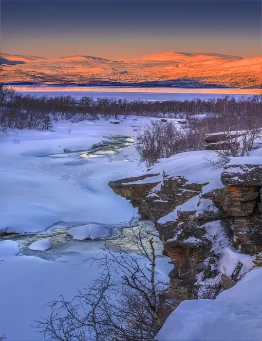 Framed Print : Dusk comes over a winter scene at Abisko National park in Lapland, Sweden