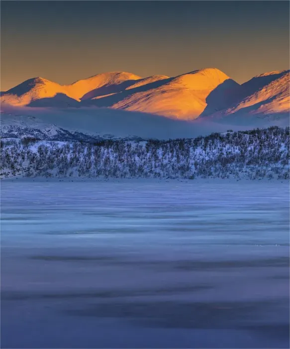 Framed Print : Dusk comes over a winter scene at Abisko National park in Lapland, Sweden