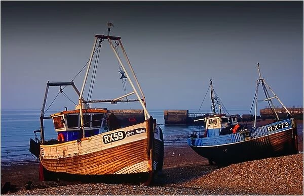Fishing Trawlers, beached at low tide at Hastings, Kent, England