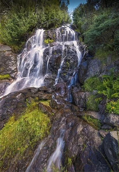 Flowing water over Falls Creek waterfall in the Alpine mountainous region of north east Victoria, Australia