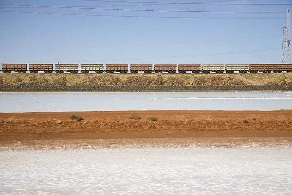 Freight train moving through a barren landscape, Port Hedland, Western Australia, Australia