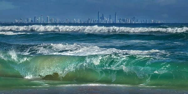 Gold Coast skyline with crashing wave