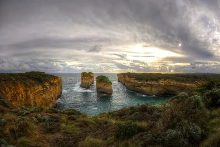 Framed Print : Great Ocean Road cliffs at cloudy sunset