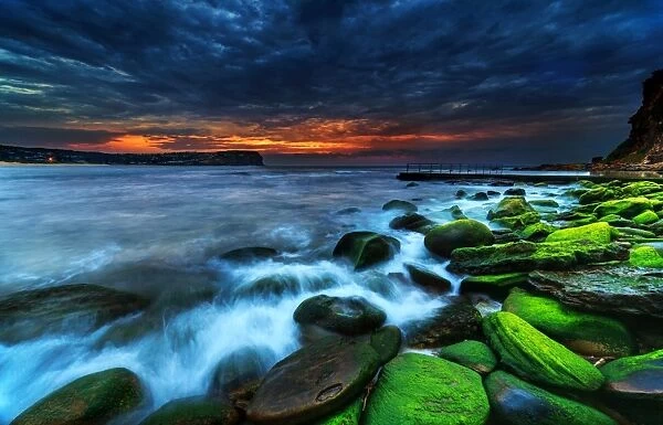 Green rocks moody sunrise