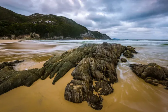 Framed Print : Hidden Bay at South Coast track, Southwest Tasmania