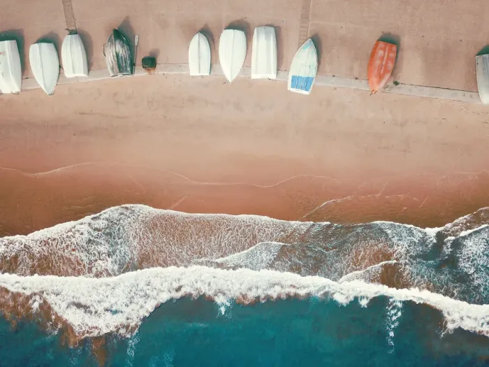 Framed Print : High angle view of small boats lined up on a sandy beach