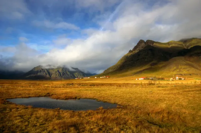 Framed Print : Icelandic houses rocky mountains and yellow grass Framed Print : Icelandic houses rocky mountains and yellow grass