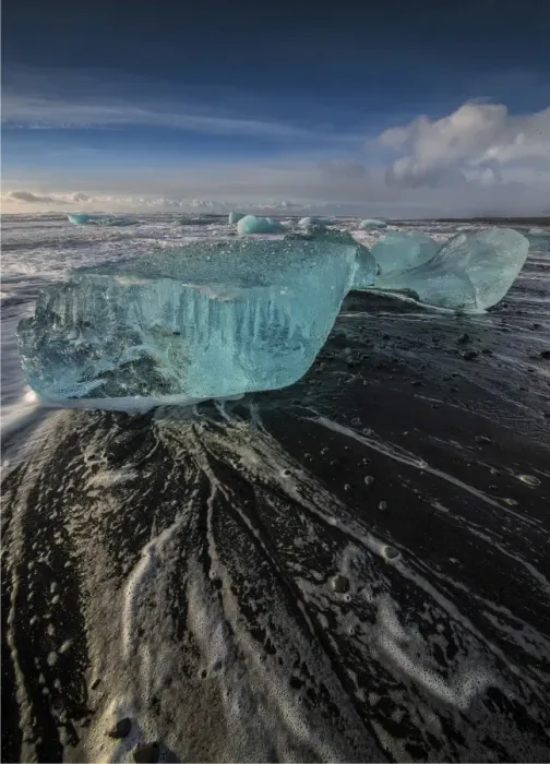 Framed Print : Jokulsarlon Beach in winter, just after a huge storm hit the coastline. Ice bergs from the nearby lagoon have been swept up onto the coastline and surge in and out with the tide Framed Print : Jokulsarlon Beach in winter, just after a huge storm hit the coastline. Ice bergs from the nearby lagoon have been swept up onto the coastline and surge in and out with the tide