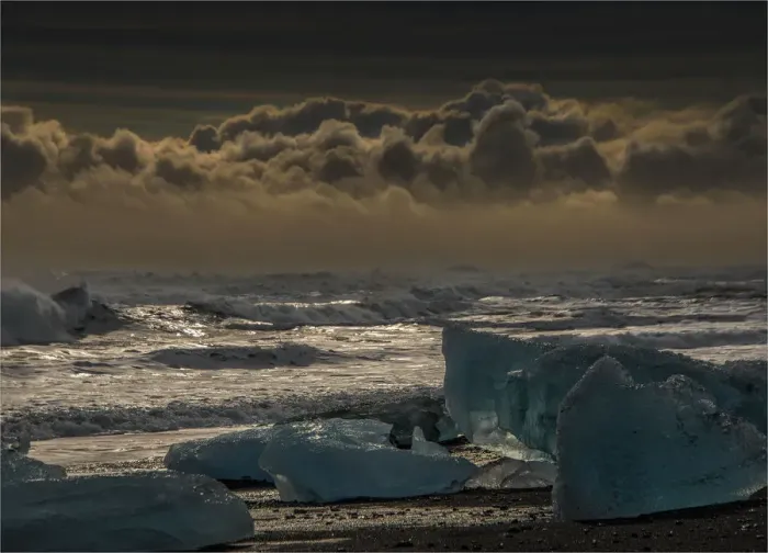 Framed Print : Jokulsarlon Beach in winter, just after a huge storm hit the coastline. Ice bergs from the nearby lagoon have been swept up onto the coastline and surge in and out with the tide Framed Print : Jokulsarlon Beach in winter, just after a huge storm hit the coastline. Ice bergs from the nearby lagoon have been swept up onto the coastline and surge in and out with the tide