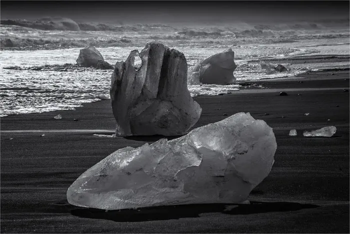 Framed Print : Jokulsarlon Beach in winter, just after a huge storm hit the coastline. Ice bergs from the nearby lagoon have been swept up onto the coastline and surge in and out with the tide Framed Print : Jokulsarlon Beach in winter, just after a huge storm hit the coastline. Ice bergs from the nearby lagoon have been swept up onto the coastline and surge in and out with the tide