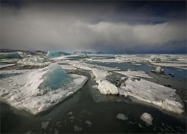 Jokulsarlon lagoon in winter with floating ice bergs after a storm