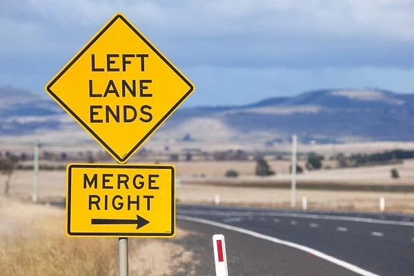 Left lane ends and merge right sign. Tasmania