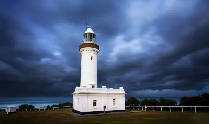 Framed Print : Lighthouse with dramatic sky