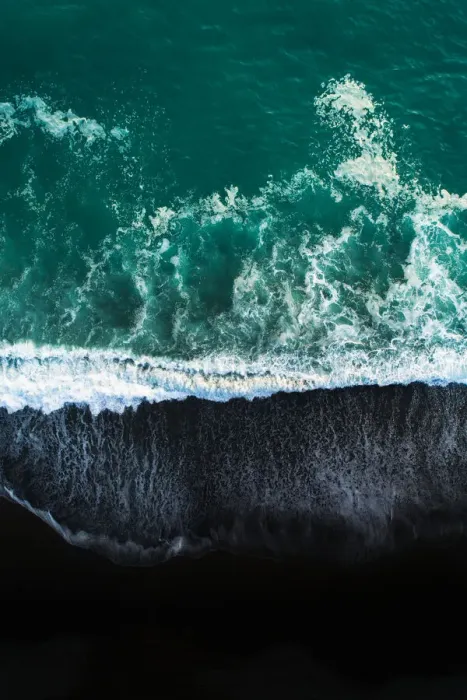 Framed Print : Looking down at black sand beach
