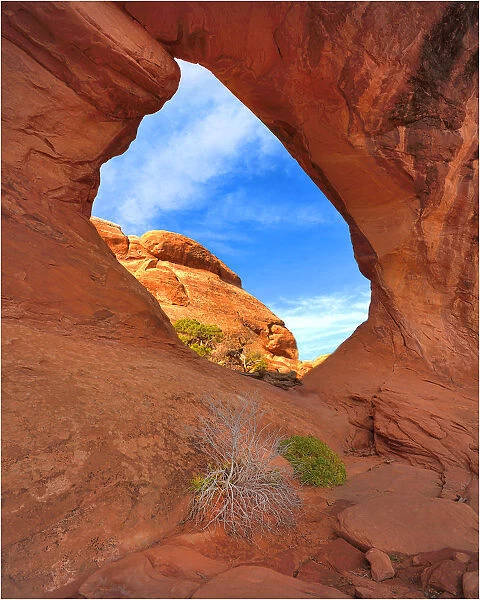Looking through Double O Arch in the Arches National Park, Utah