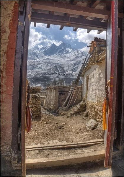 Looking out a temple doorway in Karkhot Jompa to the mountains, Mustang, Nepal