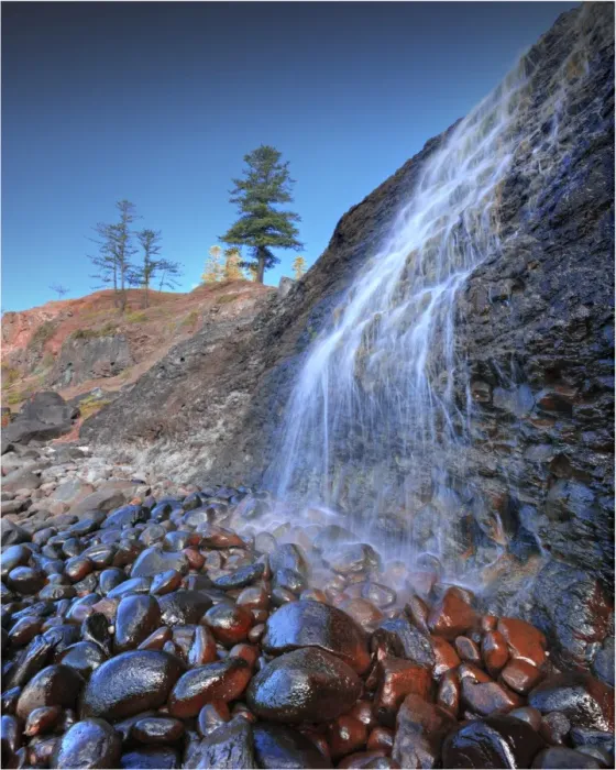 Framed Print : A low angled view of the lower Cockpit falls, which cascade over a steep cliff onto rocks, right on the coastline at Norfolk Island Framed Print : A low angled view of the lower Cockpit falls, which cascade over a steep cliff onto rocks, right on the coastline at Norfolk Island