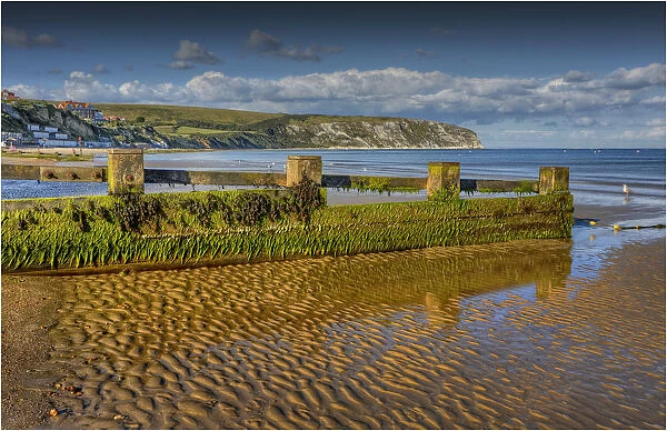 Low tide in the seaside village of Swanage, on the Jurassic coastline of Dorset, England, United Kingdom